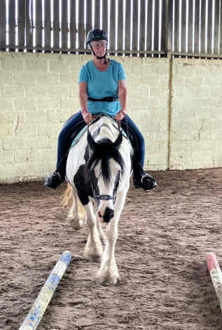 Thornton Rose RDA rider enjoing schooling indoors